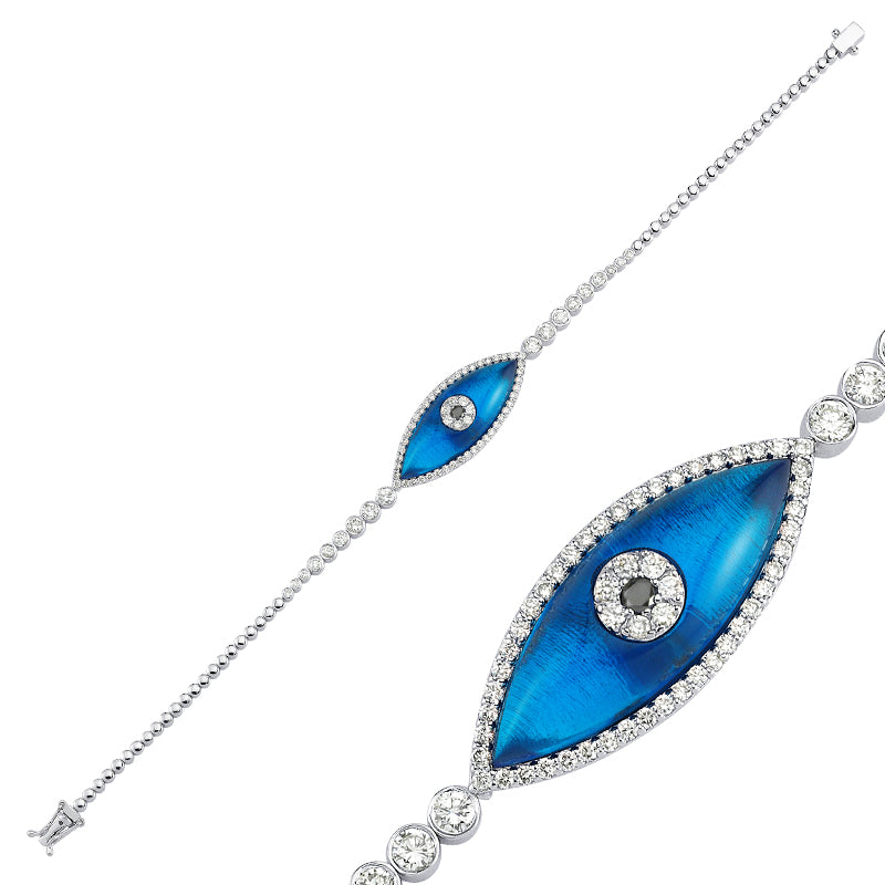 
            
                Load image into Gallery viewer, 18kt white gold and diamond, blue topaz evil eye bracelet
            
        