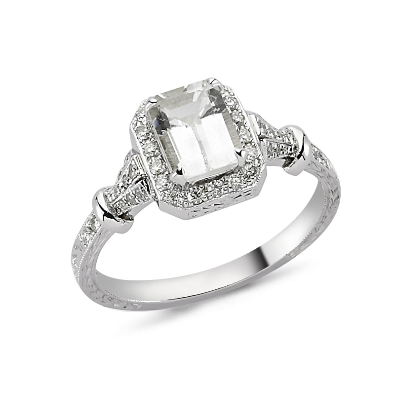 18kt white gold, diamond and white topaz engagement ring