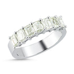 Platinum and emerald cut diamond half way wedding band